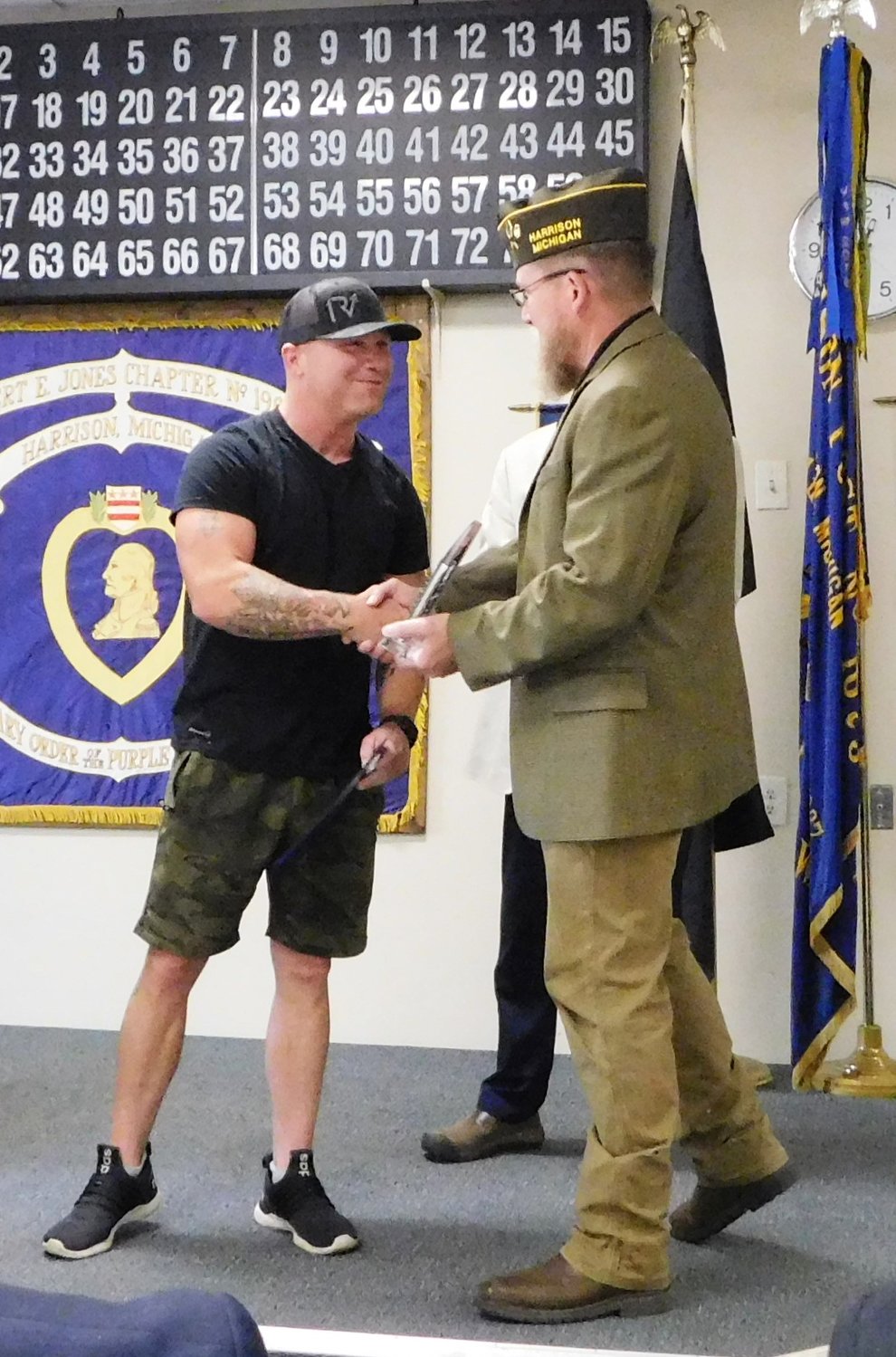 Trooper Dana Mattice receives his award from Scott Taylor.